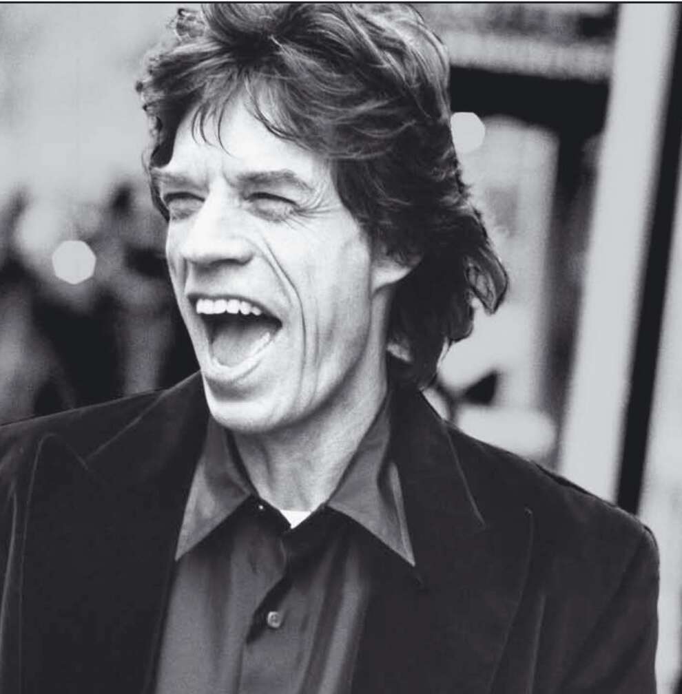 Mick Jagger lacht in die Kamera
