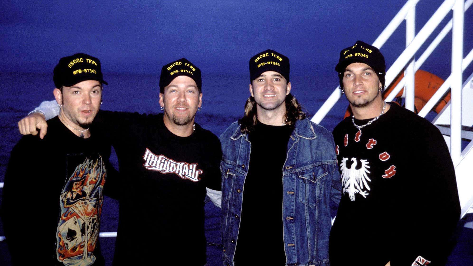 Die Bandmitglieder von Creed, Scott Stapp, Mark Tremonti, Brian Marshall und Scott Phillips im Jahr 2002