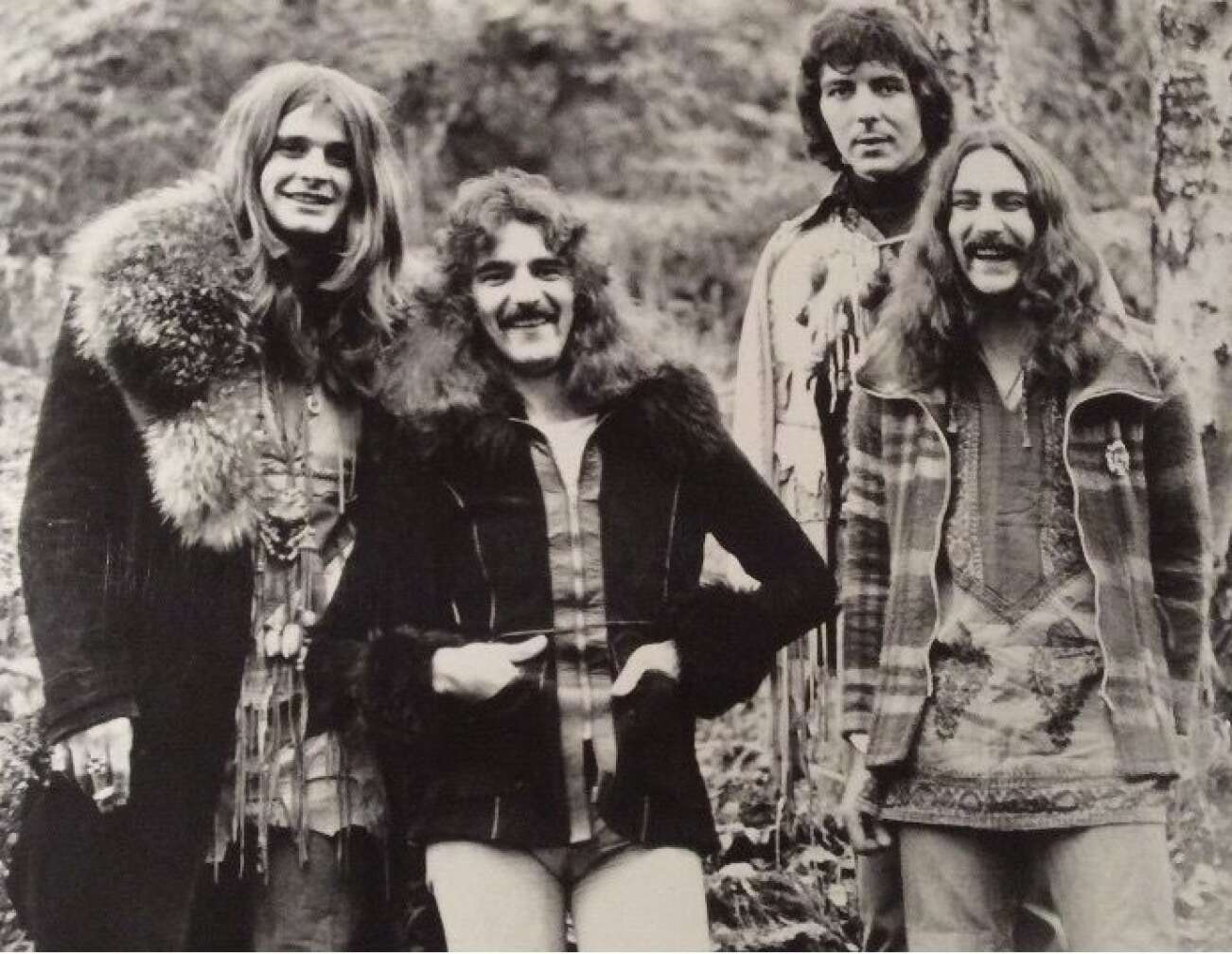 Bandmitglieder von Black Sabbath, lächelnd