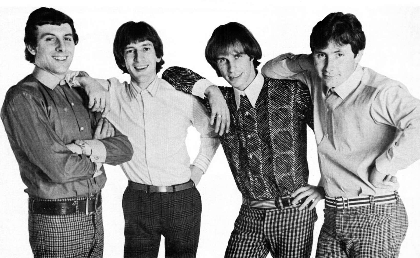 Bandmitglieder von The Troggs posieren vor der Kamera